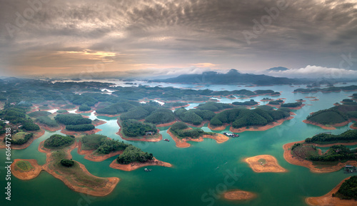 Fototapeta Naklejka Na Ścianę i Meble -  Panoramic view of Thac Ba lake from above. Thac Ba Lake consists of many small islands in Yen Binh district, Yen Bai province, Vietnam. This place attracts a lot of tourists because of its unspoiled b