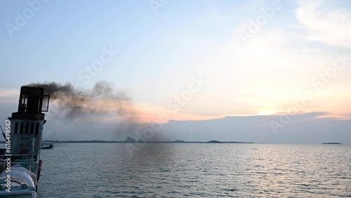 Smoke from black chimneys on board ferries or cruise ships