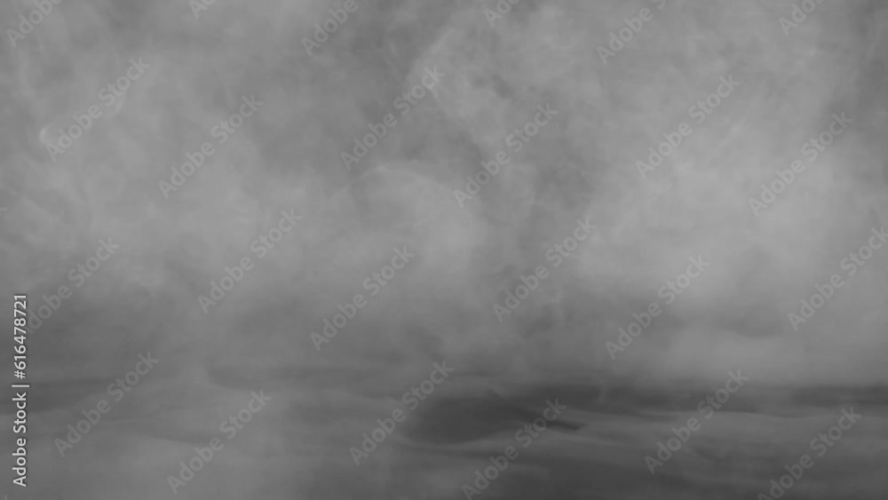 Abstract white smoke in slow motion. Smoke, Cloud of cold fog in light spot background. Light, white, fog, cloud, black background, 4k, ice smoke cloud. Floating fog.