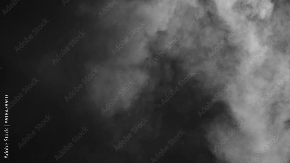 Abstract white smoke in slow motion. Smoke, Cloud of cold fog in light spot background. Light, white, fog, cloud, black background, 4k, ice smoke cloud. Floating fog.