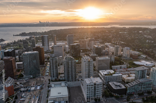 Fototapeta Naklejka Na Ścianę i Meble -  The City of Bellevue in Washington State Sunset With Dowtown Highrise in View from Above Drone Aerial Shot