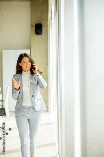 Young woman using mobile ph...