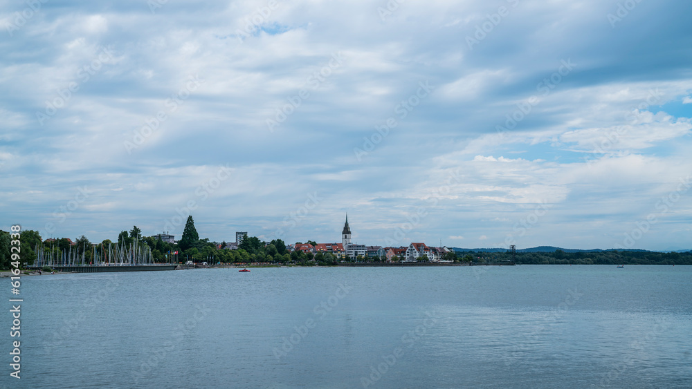 Germany, Friedrichshafen city coast skyline church houses of bodensee lake panorama view in summer