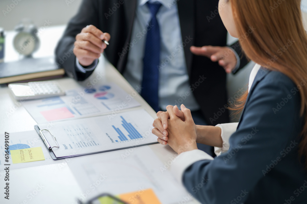 Business analyst calculating turnover figures in office..