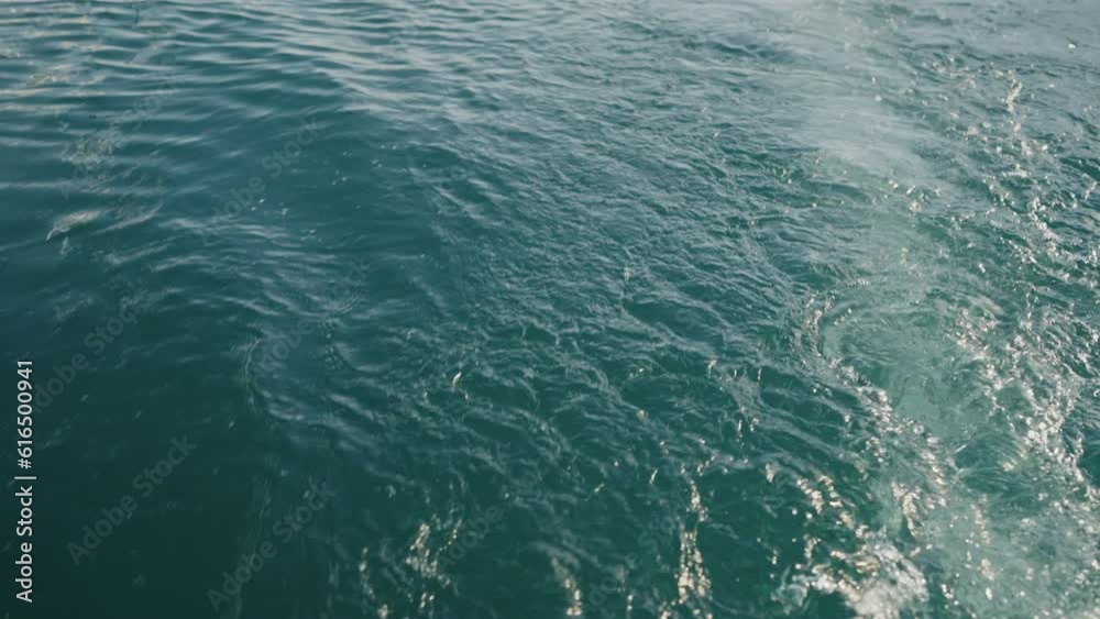 Slow motion of boat trail on a sea surface Slow motion of boat trail on a sea surface