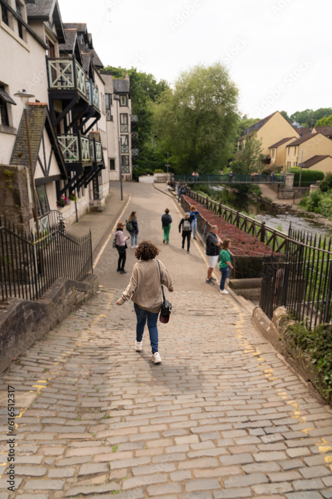 Woman walking down the road