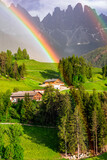 Breathtaking Dolomites rocks - most beautiful mountains in Alps, UNESCO site. Unique foto with rainbow. Beautiful valley Val di Funes in South Tyrol, Italy. Alpine nature scenery