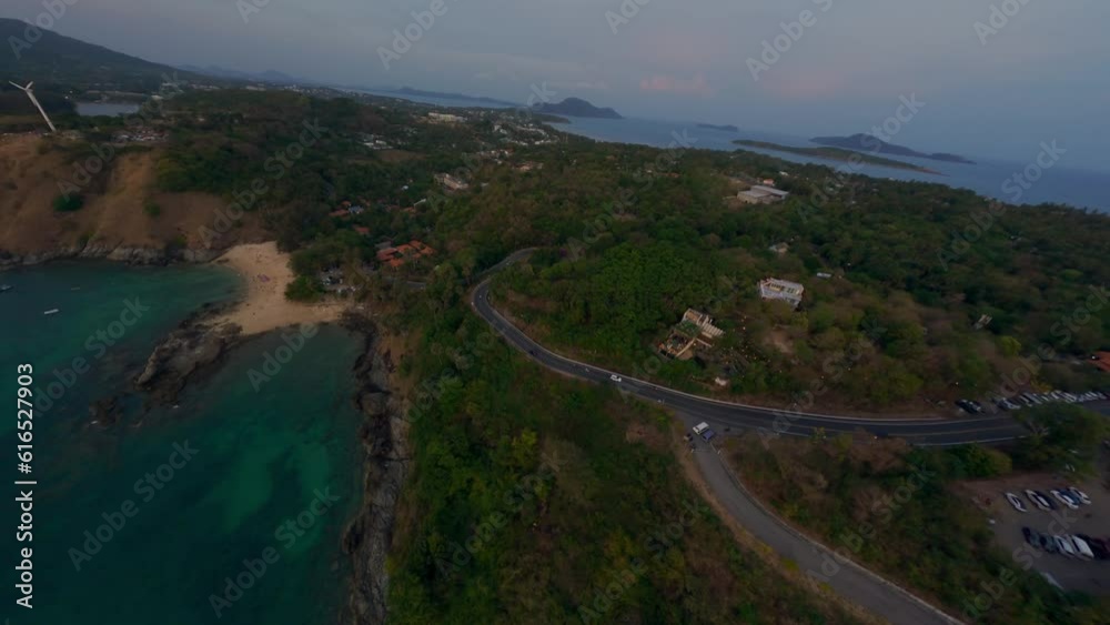 Aerial high view tropical island countryside panorama with mountain beach bay lagoon with water transport. FPV sport drone dive low shot sea landscape coastline resort harbor village sunset scenery 4k Aerial high view tropical island countryside panorama with mountain beach bay lagoon with water transport. FPV sport drone dive low shot sea landscape coastline resort harbor village sunset scenery 4k