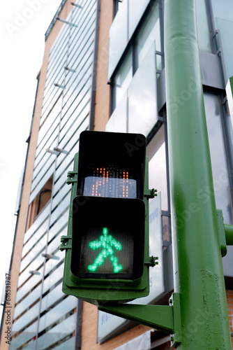 digital green pedestrian traffic light