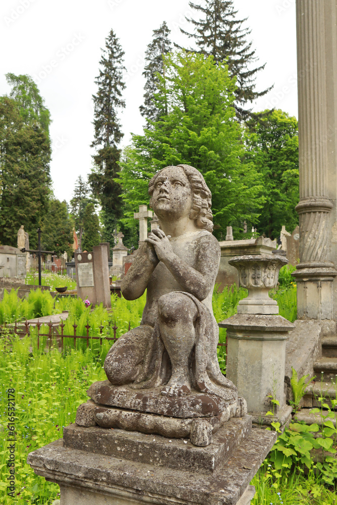 Ancient tombstone at the famous Lychakiv Cemetery in Lviv, Ukraine