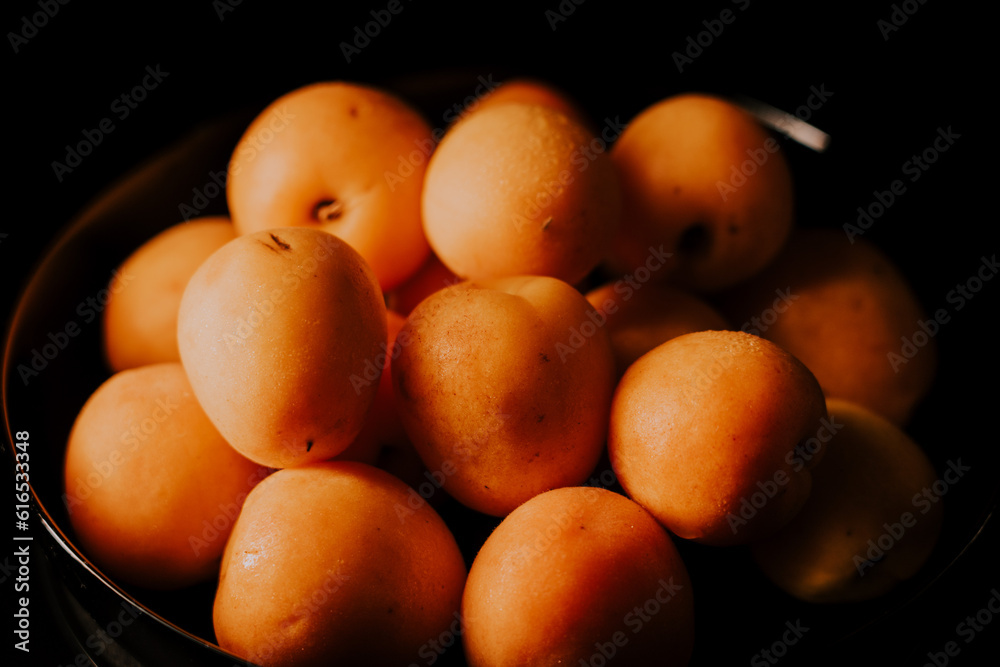 Ripe apricots on a black background Ripe apricots on a black background