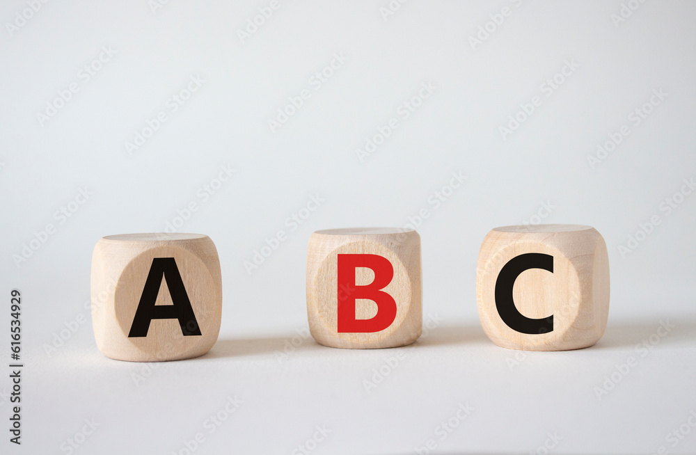 ABC symbol. Concept word ABC on wooden blocks. Beautiful white background. Business and ABC concept. Copy space ABC symbol. Concept word ABC on wooden blocks. Beautiful white background. Business and ABC concept. Copy space