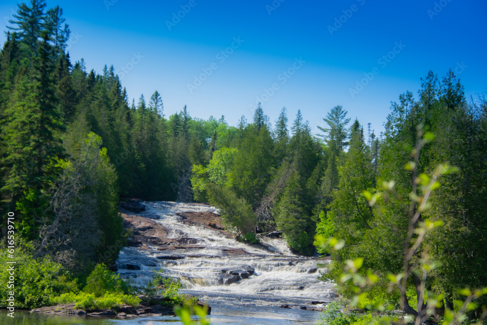 Waterfalls on a beautiful wild river in Quebec in Canada Waterfalls on a beautiful wild river in Quebec in Canada