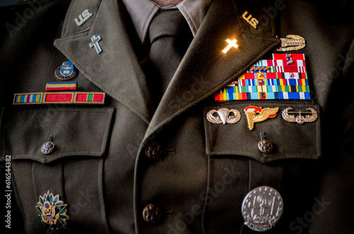 Photograph of a U.S. Army chaplain's in uniform, with lapel cross sparkling in sunlight.