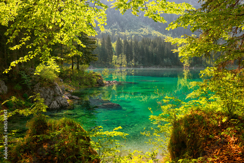 Picturesque mountain scenery and hiking place. Beautiful superior Fusine lake and Mangart mountain in background  Julian Alps  Tarvisio  Udine region  Friuli Venezia Giulia  Italy  Europe 