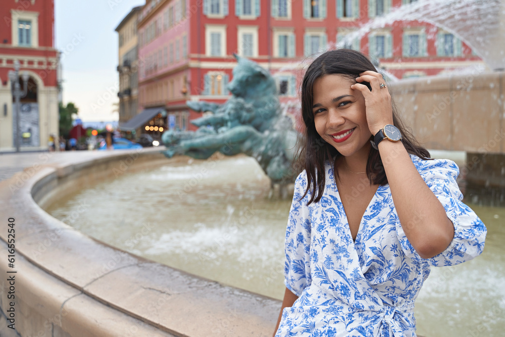 Beautiful young mixed race woman at Place Massena in Nice, France