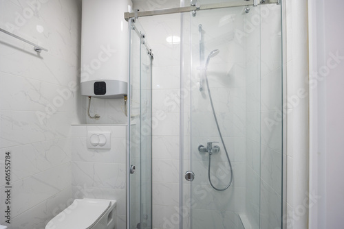 Bathroom interior with glass shower cabin