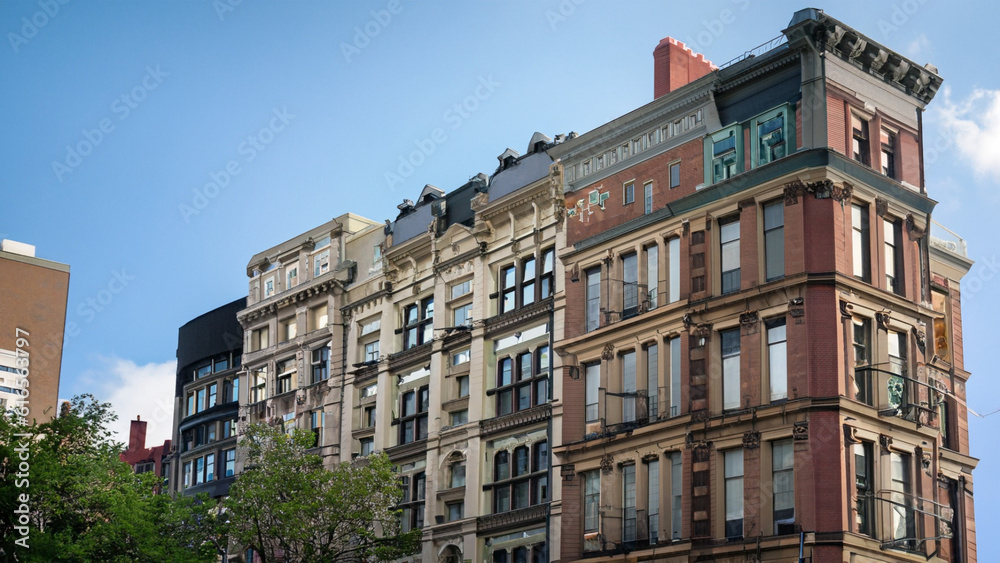 a view of a row of historic brownstone buildings in an iconic ...