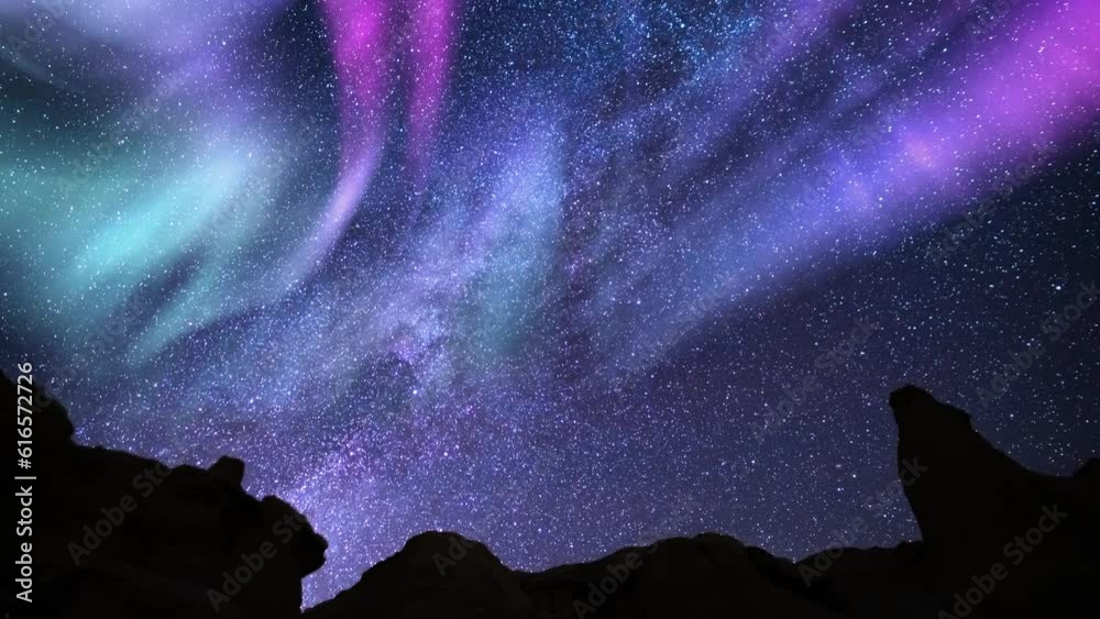 Solar Storm Aurora Purple and Green Milky Way Galaxy Time Lapse over Rock Formatton Solar Storm Aurora Purple and Green Milky Way Galaxy Time Lapse over Rock Formatton