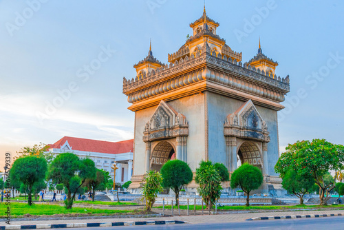 Patuxay a tall tower sunset with street Vientiane laos photo