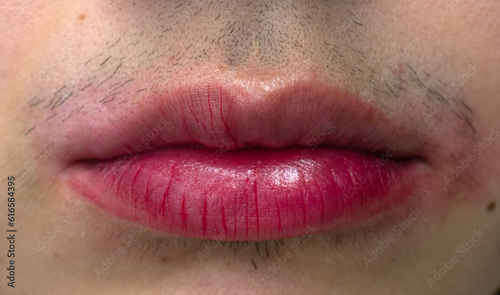 woman with a mustache wearing wiped-off lipstick woman with a mustache wearing wiped-off lipstick