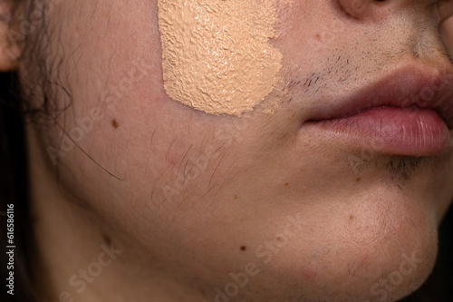 Quadro em tela Close-up of a woman with a mustache face with foundation makeup on