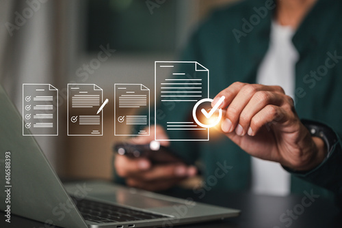 Fotografie Performance checklist, businessman using checklist survey, filling out digital form checklist, take an assessment, questionnaire, evaluation, online survey, online exam