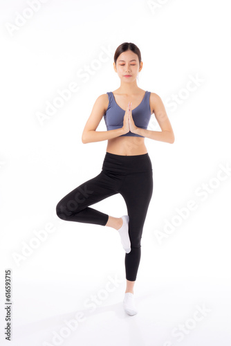 Portrait beautiful young asian woman in sportswear doing practice yoga for relax isolated white background, female exercise and workout training for leisure, sport and health care concept. © N_studio