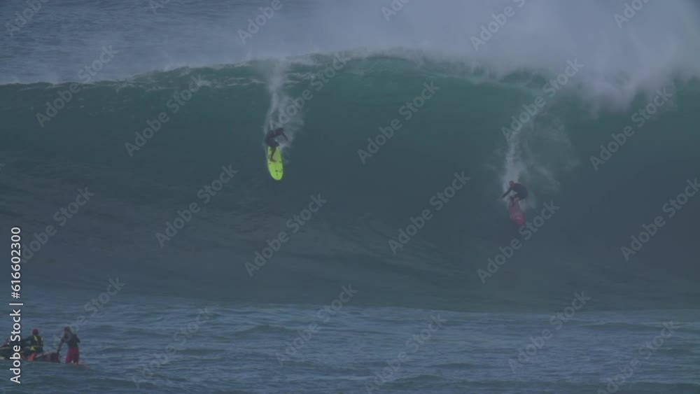 Slow Motion Shot Of People Surfing On Splashing Large Waves In Sea During Vacation - Oahu, Hawaii