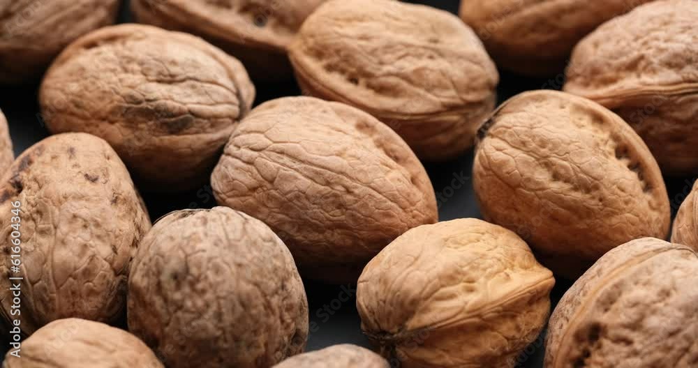 Whole walnuts close-up on sliding platform