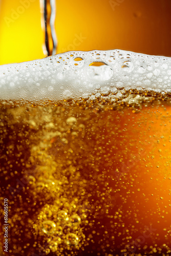 Glass of tasty beer with foam, closeup.