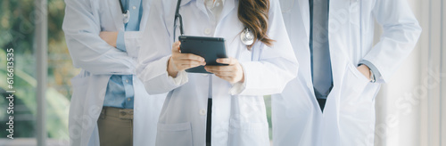 Female Asia doctor using digital tablet