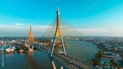 Bridge view from the top view of the drone Thailand, Car transport bridge, and river landscapes bird's eye view during sunset photo