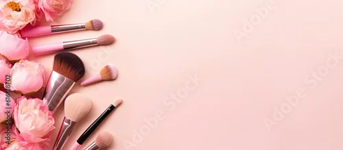 Obraz A bunch of makeup brushes and flowers on a pink background created with Generative AI technology
