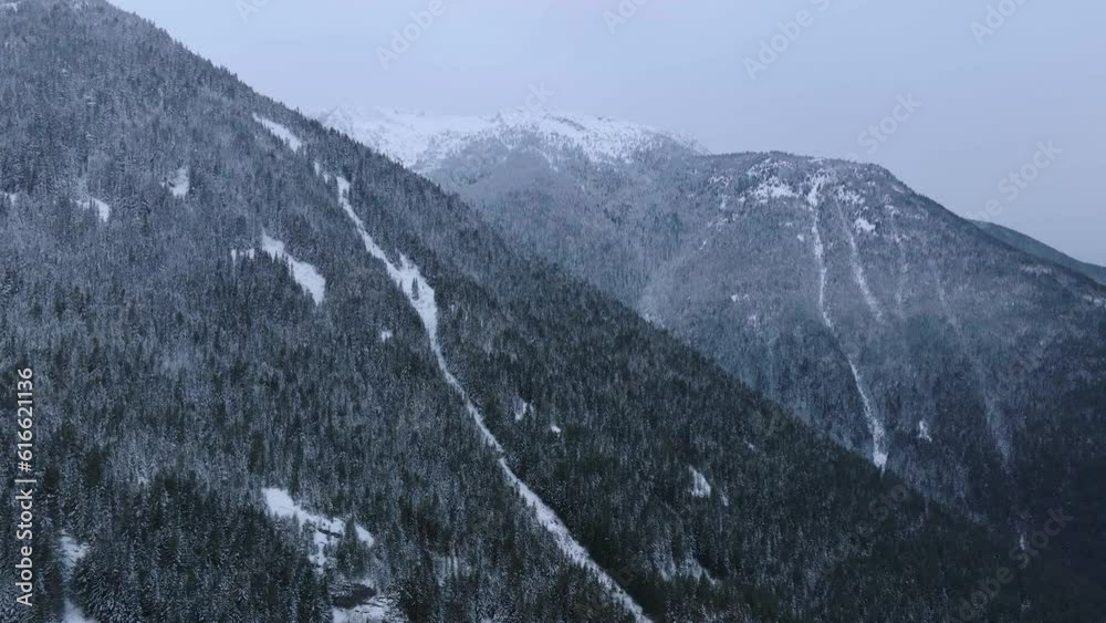 Aerial view of winter rocky mountains in gloomy day. Chilliwack Aerial view of winter rocky mountains in gloomy day. Chilliwack