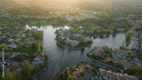 Aerial view of rich suburban neighbourhood of Calabasas Lake, Los Angeles county, USA. The most expensive houses and luxury mansions within exclusive gated communities. High quality 4k footage photo