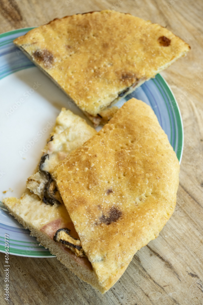 focaccia stuffed with ham, mushrooms and cheese focaccia stuffed with ham, mushrooms and cheese