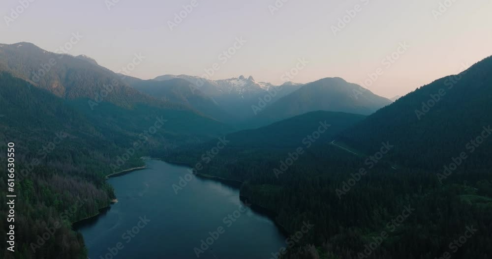 Aerial drone view over picturesque Capilano Lake in North Vancouver, Canada. Aerial drone view over picturesque Capilano Lake in North Vancouver, Canada.