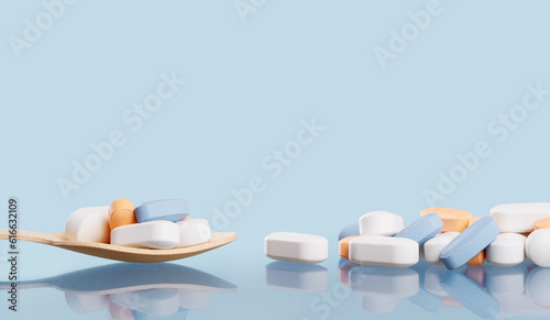 Medical background of many white capsule tablets or pills on blue table. Close up. Healthcare pharmacy and medicine concept with copy space Painkillers or prescription drugs consumption