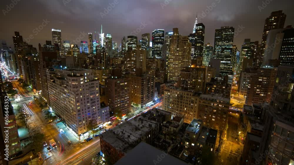 Panning Time Lapse Shot Of Illuminated Buildings In City Against Sky At Night - New York City, New York Panning Time Lapse Shot Of Illuminated Buildings In City Against Sky At Night - New York City, New York