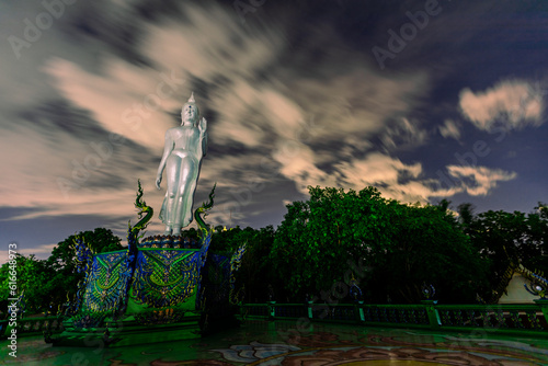 Background of Thailand's Chonburi religious attractions (Wat Khao Phra Khru viewpoint), with beautiful Buddha and Phaya Naga statues, tourists always come to make merit and take pictures at night. photo