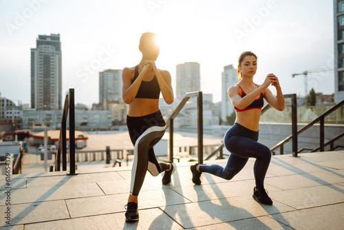 Two women in sportive clothes have fitness day outdoors together. Sport, Active life, sports training, healthy lifestyle.