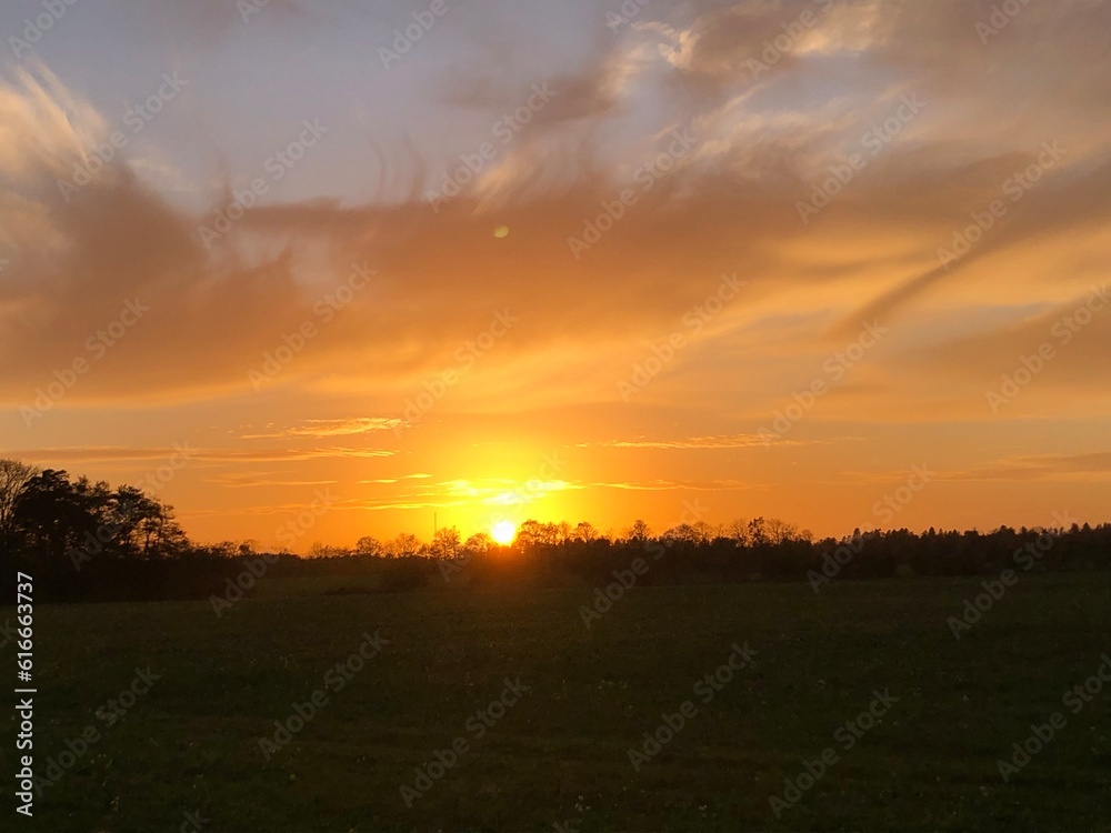 sunset over the field sunset over the field
