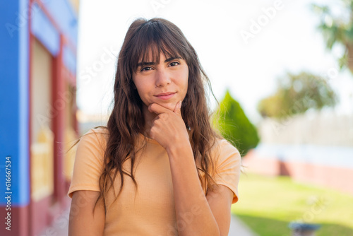 Young woman at outdoors thinking