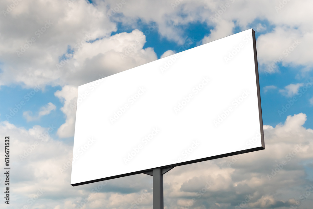 Mock up - blank white billboard or large advertising display against blue sky with white clouds. Template, consumerism, white screen, mock up and copy space concept Mock up - blank white billboard or large advertising display against blue sky with white clouds. Template, consumerism, white screen, mock up and copy space concept