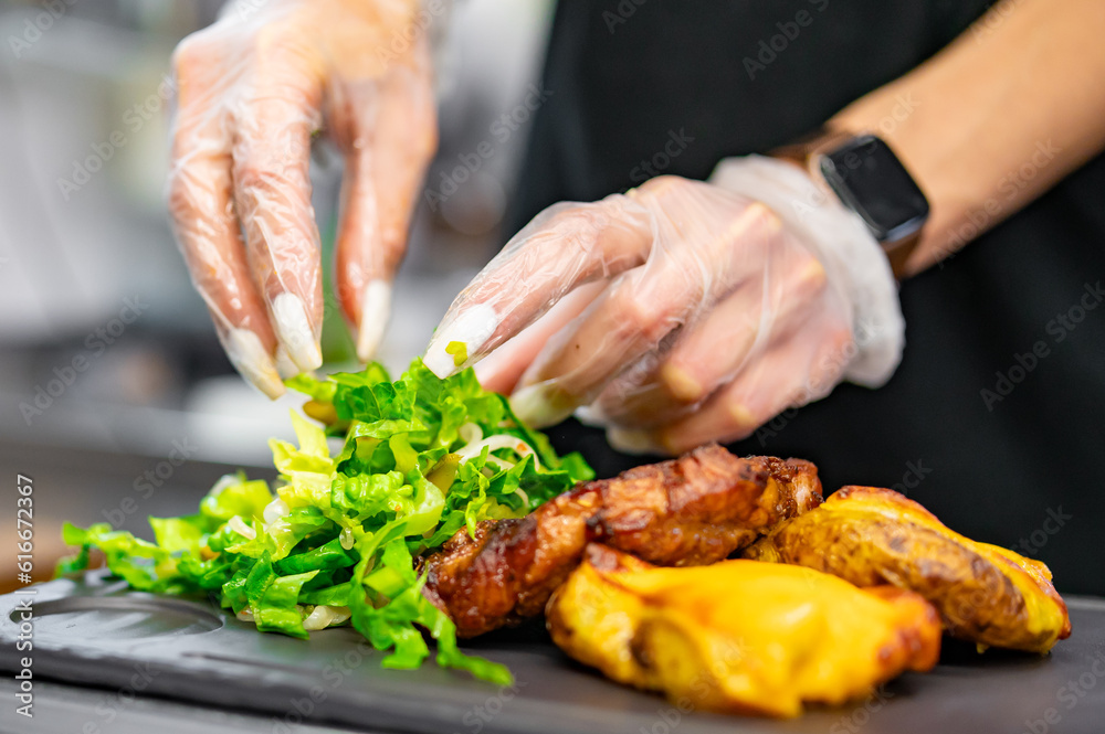 woman chef hand cooking grilled pork neck with baked potatoes and salad