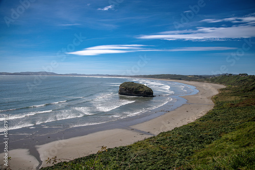 run stone in ancud chiloe island chile on a beach with strong winds and strong currents photo