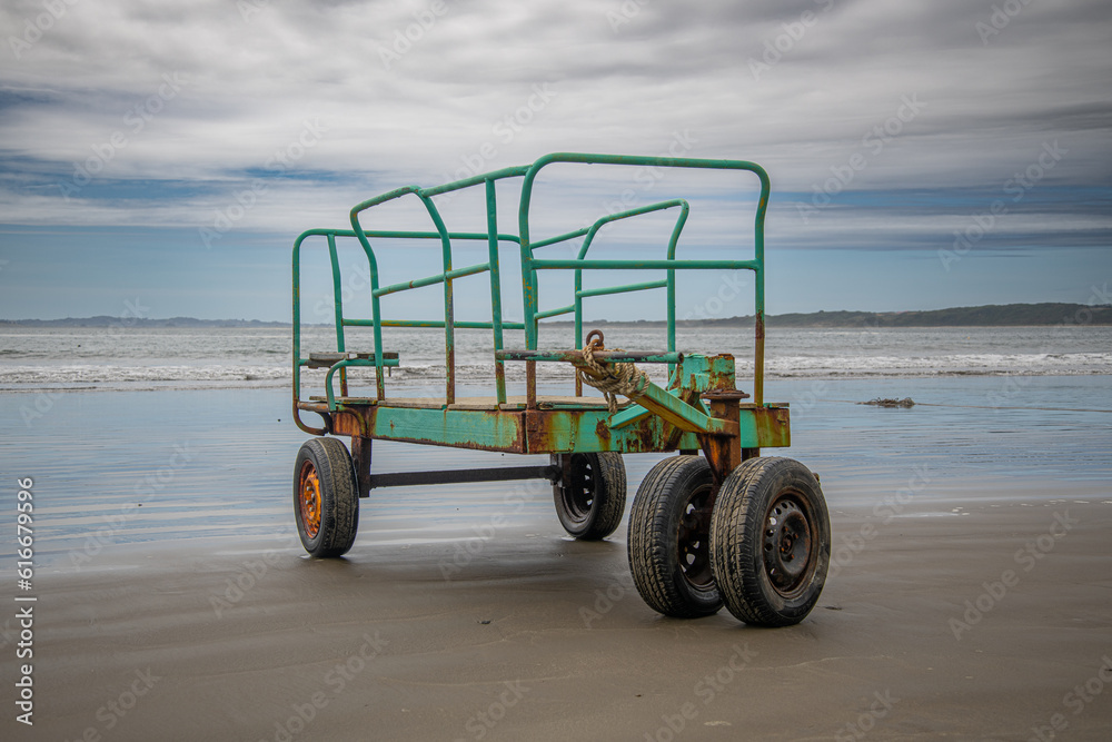 Old and rusty metal cart with rubber wheels dedicated to transporting
