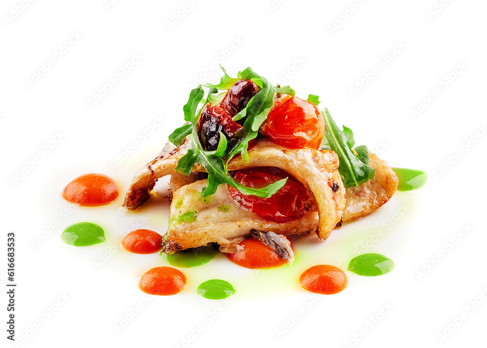 Fried white fish fillet with tomatoes and arugula