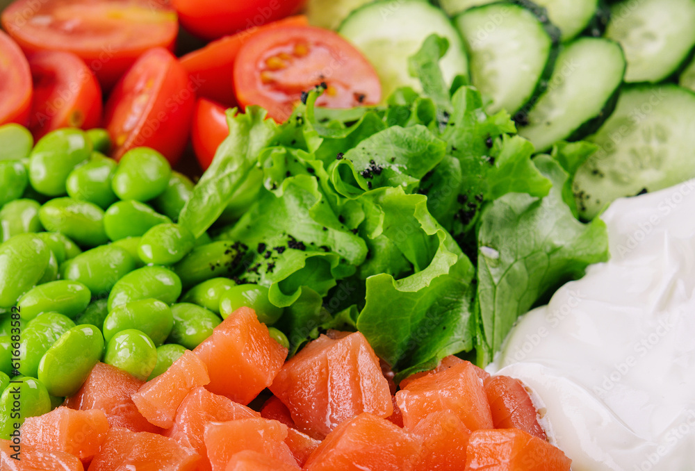Poke bowl with salmon, cucumber, tomato, rice and edamame beans Poke bowl with salmon, cucumber, tomato, rice and edamame beans
